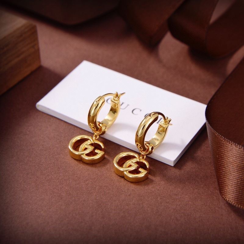 G*u*i earrings